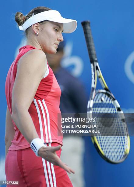Russian tennis player Nadia Petrova tosses her racket during her match against Antonella Serra Zanetti of Italy during the semi final round of tennis...