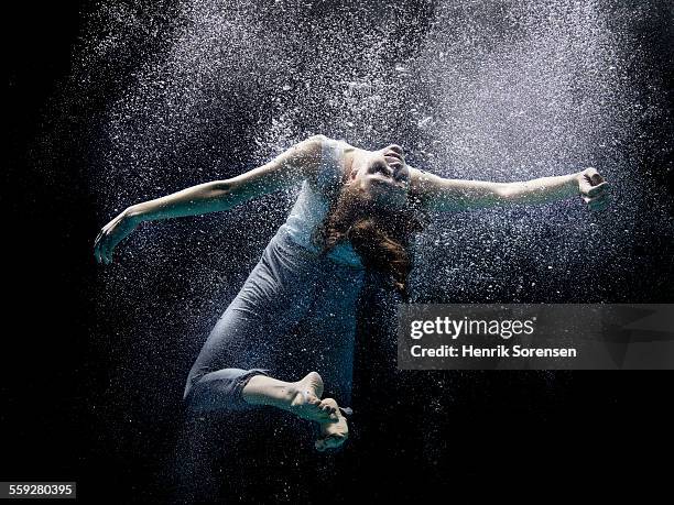 woman floating under water