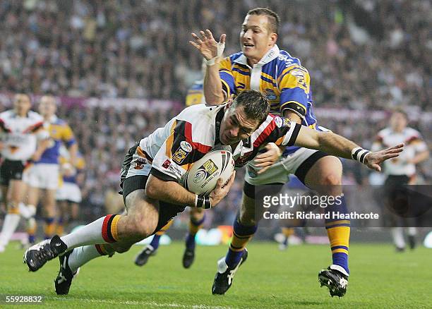 Michael Withers of Bradford is tackled behind his own tryline by Danny McGuire of Leeds during the Engage Super league Grand Final between Leeds...