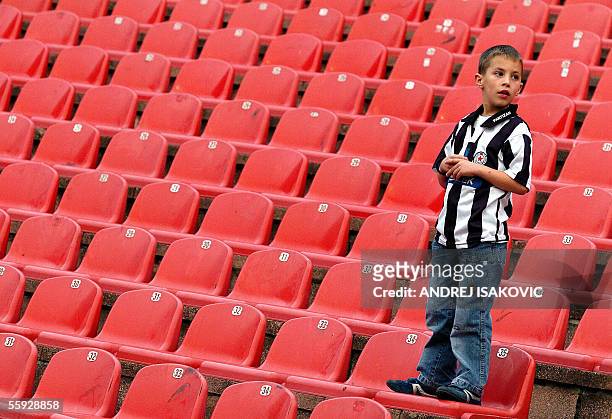 Lonely young supporter of FC Partizan Belgrade stands on the part of "Marakana" stadium where usually gather the fans of Partizan, in Belgrade, 15...