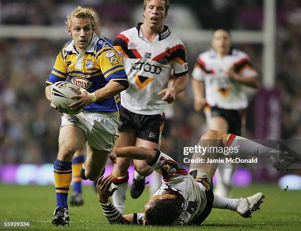 Rob Burrows of Leeds blasts past Shontane Hape of Bradford during the Engage Super league Grand Final between Leeds Rhinos and Bradford Bulls at Old...