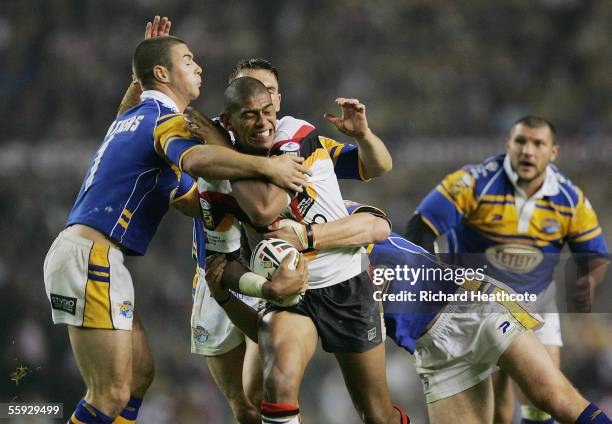 Leon Pryce of Bradford is wrapped up the Leeds defence during the Engage Super league Grand Final between Leeds Rhinos and Bradford Bulls at Old...
