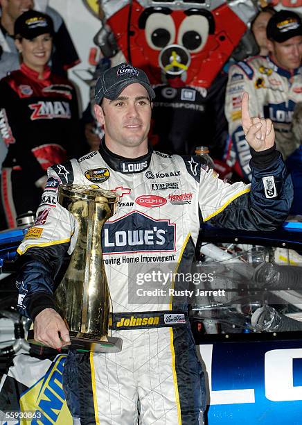 Jimmie Johnson, driver of the Lowes Chevrolet, celebrates winning the NASCAR Nextel Cup Series UAW-GM Quality 500 on October 15, 2005 at the Lowes...