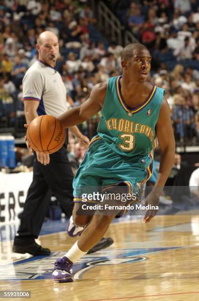 Rookie Chris Paul of the New Orleans/Oklahoma City Hornets dribbles against the Orlando Magic during a preseason game at St. Pete Times Forum on...
