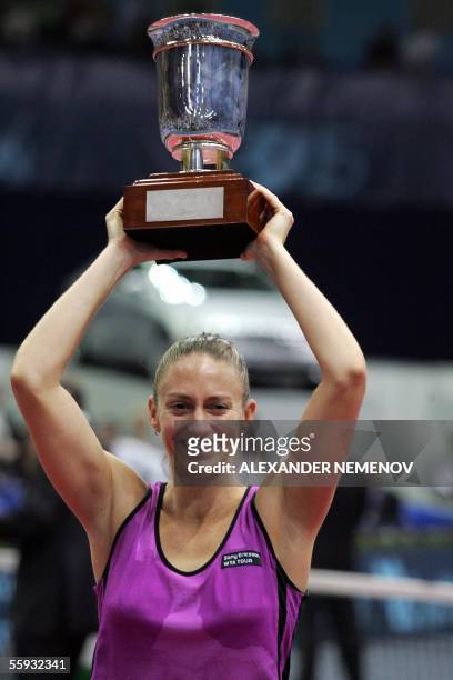 Moscow, RUSSIAN FEDERATION: French Mary Pierce poses with the Kremlin Cup trophy after defeating Italian Francesca Schiavone 2-0 during their Kremlin...
