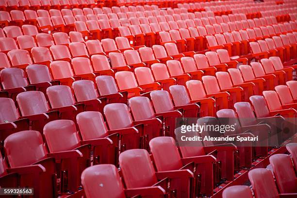 red seats without people at arena / stadium - arena di verona stock pictures, royalty-free photos & images