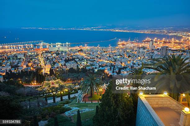 haifa bahai gardens and bay at dusk - haifa stock pictures, royalty-free photos & images