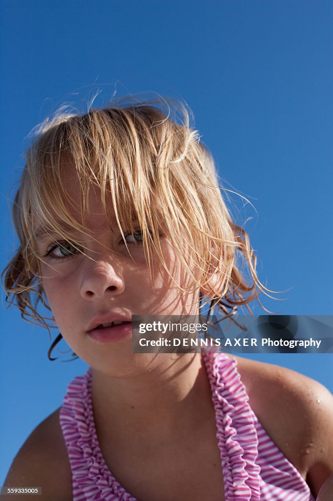 Girl at the beach with blue sky