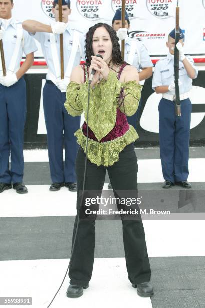 Recording artist Rachelle Dobin performs the national anthem during the Toyota 400 Indy car race at the California Speedway on October 16, 2005 in...