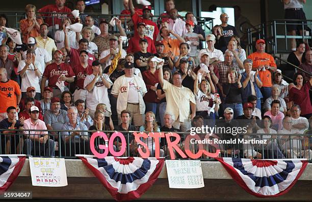 Fans of the Houston Astros cheer after Jason Lane hit a solo home run during Game Four of the National League Championship Series against the St....