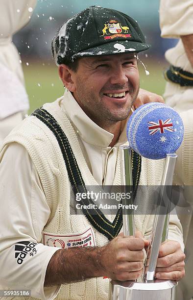 Ricky Ponting of Australia celebrates with the trophy after victory over the ICC World XI on day four of the Johnnie Walker Super Series Test between...