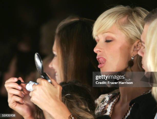 Actress/Model Paris Hilton does her makeup in the front row at the Louis Verdad Spring 2006 show during Mercedes-Benz Fashion Week at Smashbox...