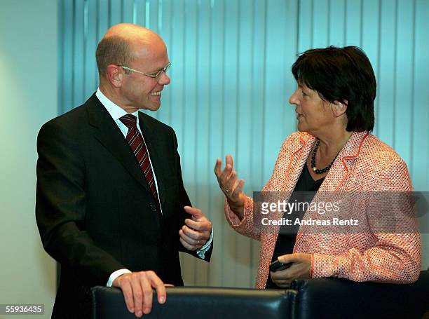 Doctor Thomas Steg, deputy government spokesman and Minister of Health , Ulla Schmidt of the German Social Democrats party talk before a meeting of...