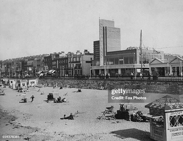 Margate beach, with the entrance to the Dreamland amusement park in the background, Kent, England, 1933.