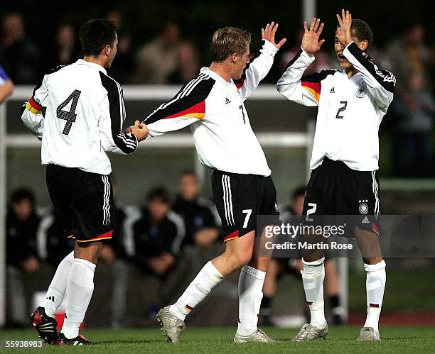 Marc Andre Kruska, Rouwen Hennings and Fabian Johnson of Germany celebrate scoring the second goal during the UEFA Under 19 European Championship...