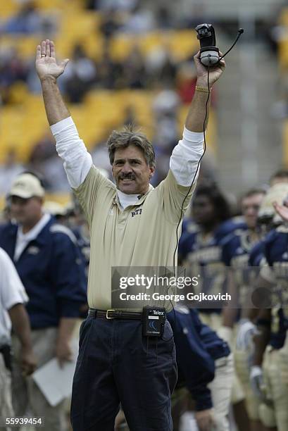 Head coach Dave Wannstedt of the University of Pittsburgh Panthers raises his arms to signal a touchdown after his team scored its third touchdown...