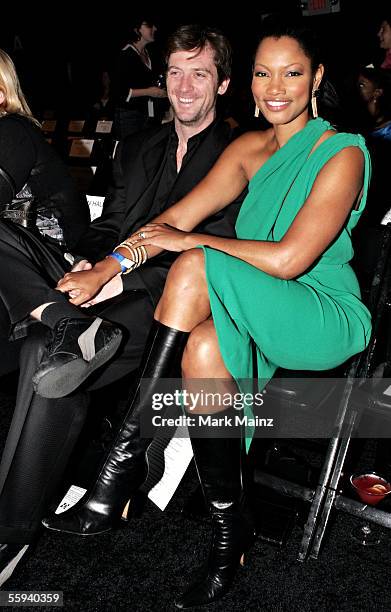 Actress Garcelle Beauvais-Nilon and husband Mike Nilon pose in the front row at the Kevan Hall Spring 2006 show during Mercedes-Benz Fashion Week at...