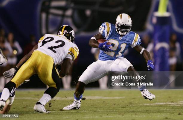 Running back LaDainian Tomlinson of the San Diego Chargers carries the ball against linebacker James Harrison of the Pittsburgh Steelers at Qualcomm...