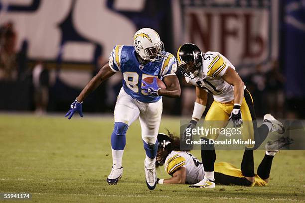 Tight end Antonio Gates of the San Diego Chargers carries the ball against linebacker James Farrior of the Pittsburgh Steelers at Qualcomm Stadium on...