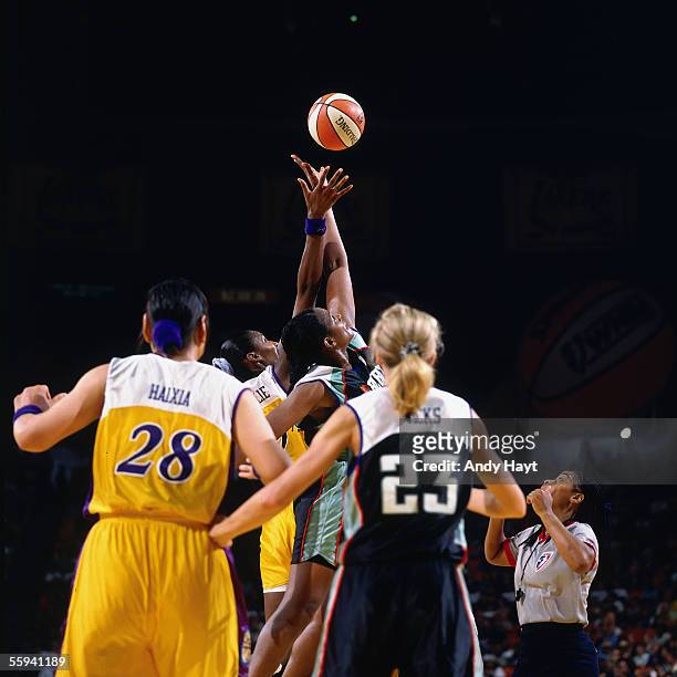 Lisa Leslie of the Los Angeles Sparks goes up for the opening tip off against the New York Liberty in the WNBA Season Opener at the Great Western...