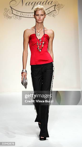 Model walks the runway at the Naqada Spring 2006 show during Mercedes-Benz Fashion Week at Smashbox Studios on October 17, 2005 in Culver City,...