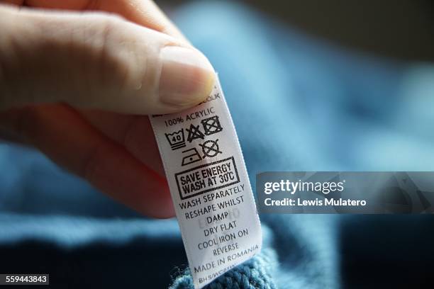 cleaning clothes  - clothing tag stock pictures, royalty-free photos & images