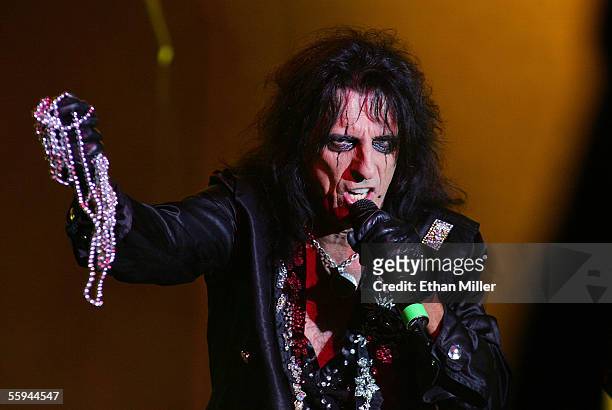 Singer Alice Cooper tosses beads to the audience as he performs during a sold out show at the Joint inside the Hard Rock Hotel & Casino October 17,...