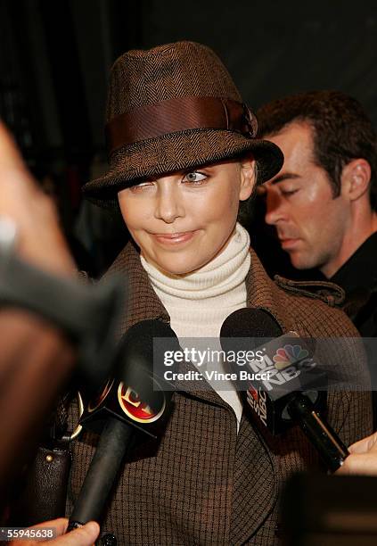 Actress Charlize Theron is interviewed backstage at the Pegah Anvarian Spring 2006 show during Mercedes-Benz Fashion Week at Smashbox Studios on...