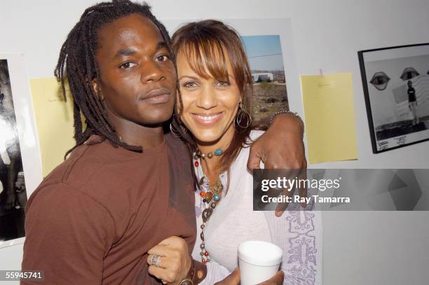 Exhibit organizer Dwayne R. Rodgers and actor Nicole Ari Parker attend the Resurrections Photography Exhibit Opening at the Latincollector Art Center...