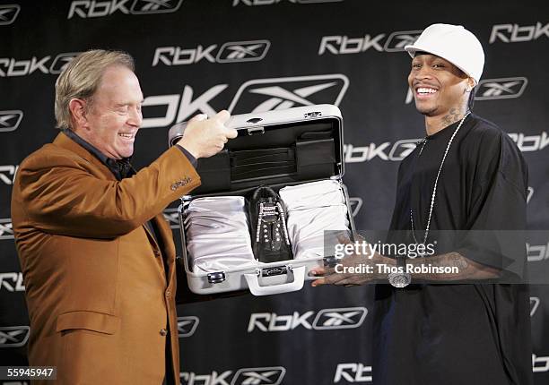 Paul Fireman, Chairman and CEO, Reebok International LTD presents Philidelphia 76ers Allen Iverson with a diamond studded RBK shoe while attending...