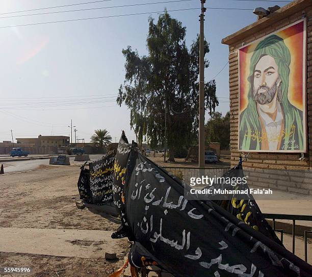 Portrait of the holy Shiite Imam Ali is seen at the entrance of the mostly Shiite town of Dujail, on October 8 35 miles north of Baghdad, Iraq. On...