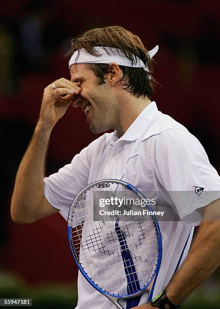 Greg Rusedski of Great Britain looks dejected after losing a point as he was beaten by Ivo Karlovic of Croatia in the first round of the ATP Madrid...