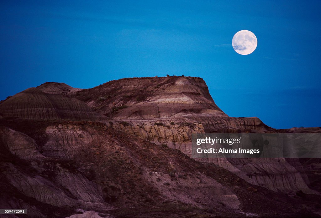 Moonrise over badlands