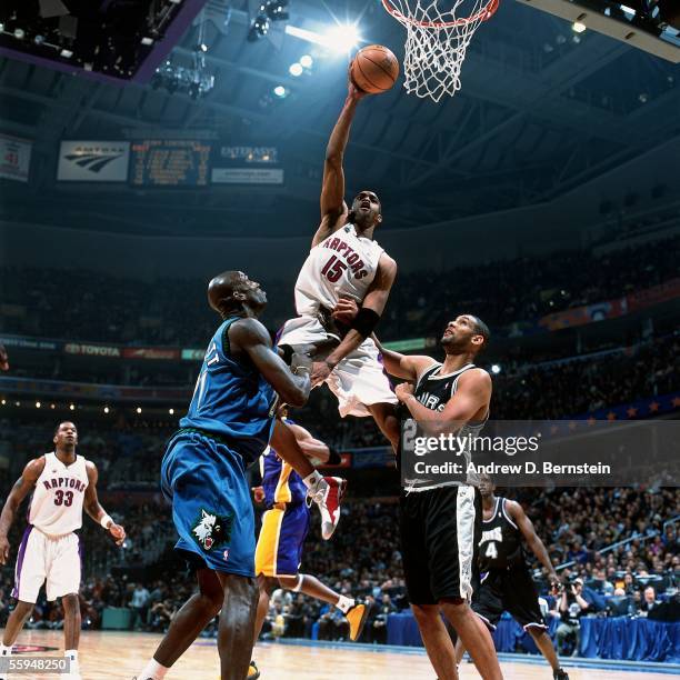 Vince Carter of the Eastern Conference All-Stars goes up for a slam dunk against the Western Conference All-Stars during the 2000 NBA All-Star game...