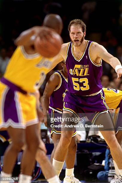 Mark Eaton of the Utah Jazz plays defense against the Lakers during an NBA game circa 1991 at the Forum in Inglewood, California. NOTE TO USER: User...