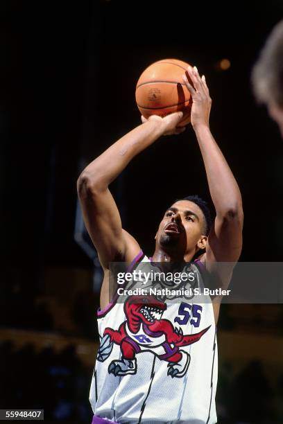 Acie Earl of the Toronto Raptors shoots a jumpshot against the Vancouver Grizzlies during an NBA game circa 1996 at Air Canada Centre in Toronto,...