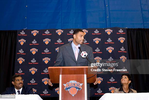 New York Knick Allan Houston speaks announces his retirement during a press conference as New York Knick executive Steve Mills and his wife Tamara...