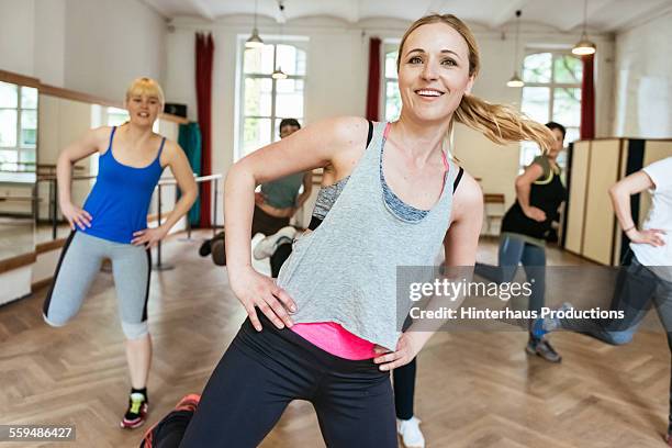 aerobics class exercising in gym - aerobics stock pictures, royalty-free photos & images