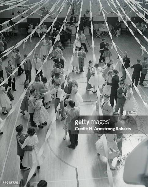 Circa 1950s: Overhead View Of Couples At Prom Dancing Streamers Decorating Gym.