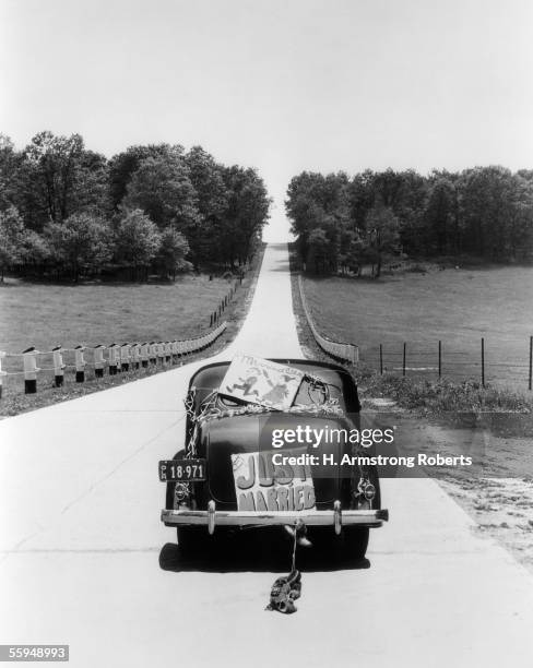 Circa 1930s: Back View Of Car With "Just Married" Sign.