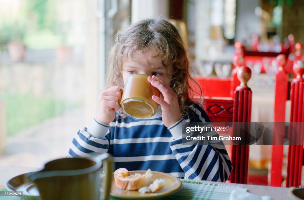 Girl Having Breakfast in Cafe