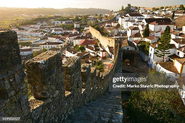 sunrise over obidos - obidos photos et images de collection
