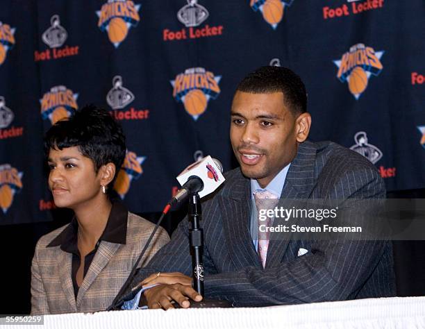 New York Knick Allan Houston speaks announces his retirement during a press conference with his wife Tamara at the New York Knicks Practice Center...