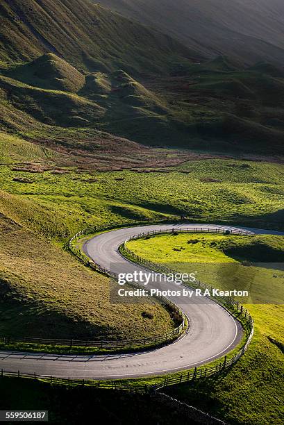 s shaped bend on a country road - letter s stock-fotos und bilder