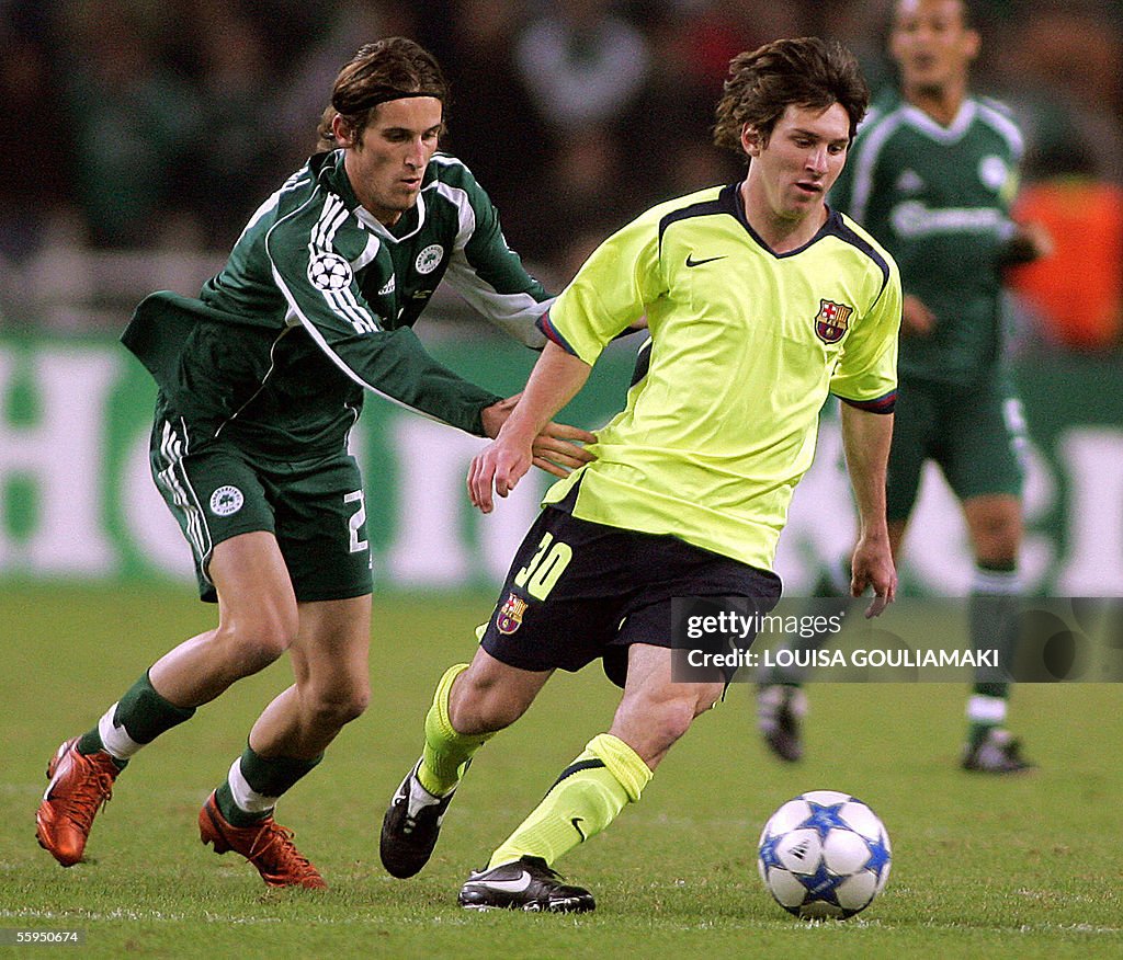 Barcelona's Lionel Messi (R) vies with P