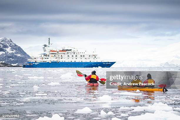 cruise ship and kayakers, cierva cove - antarctica people stock pictures, royalty-free photos & images