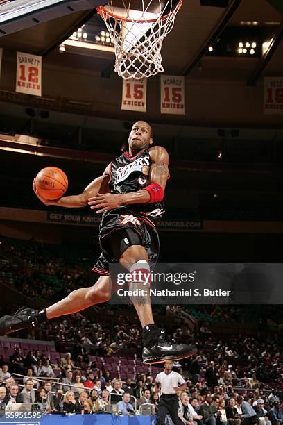 Andre Iguodala of the Philadelphia 76ers dunks against the New York Knicks on October 18, 2005 at Madison Square Garden in New York City. NOTE TO...