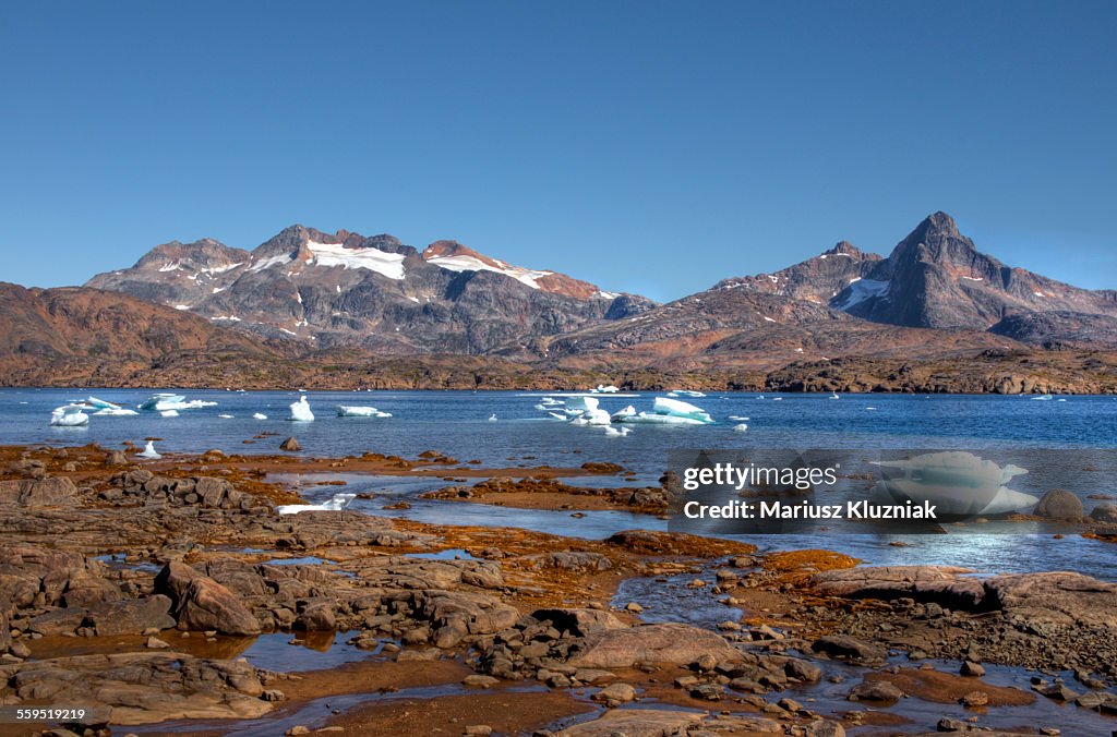 Greenland coast low summer tide and floating ice
