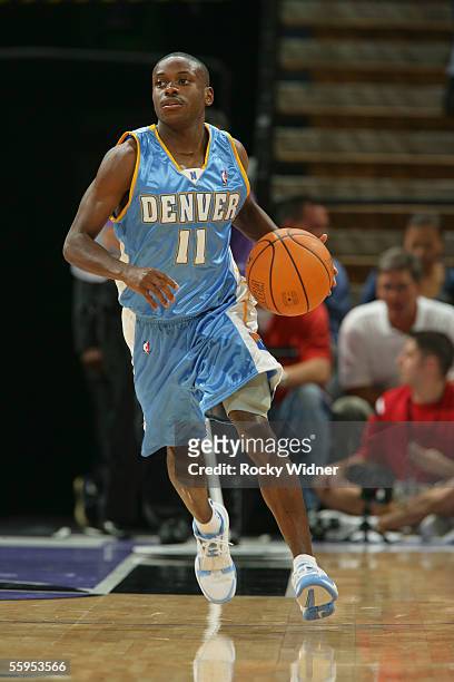 Earl Boykins of the Denver Nuggets brings the ball up court against the Sacramento Kings during a pre season game against the Denver Nuggets at the...