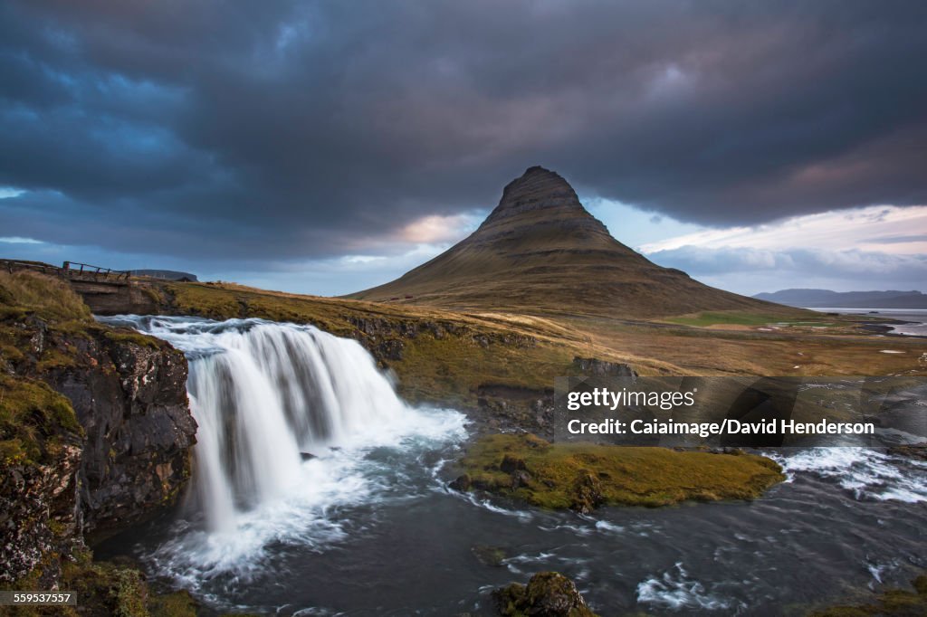 Scenic view of waterfall and landscape, Kirkjufell, Snaefellsnes, Iceland